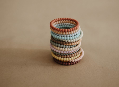 Photo de Mushie® Lot de 3 bracelets de dentition en silicone Pearl Linen/Peony/Pale Pink